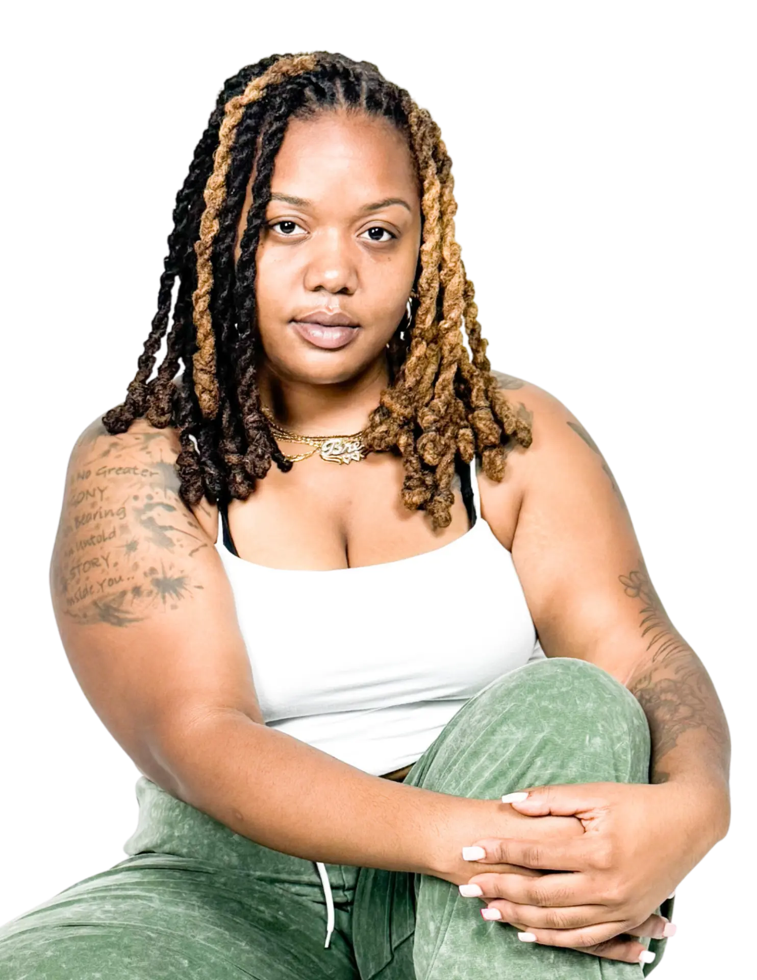 Briana, the photographer behind Clover Clicks, seated and looking at the camera